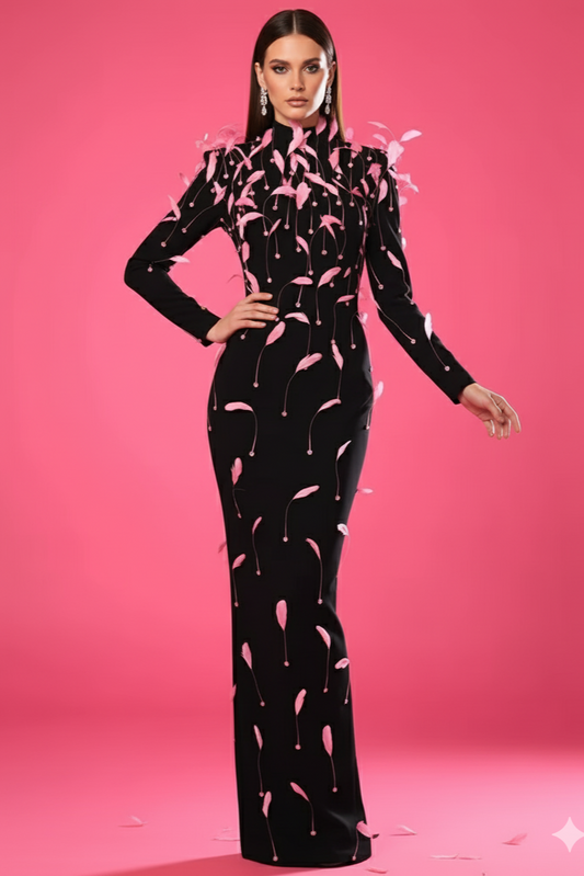 Woman wearing a black dress with pink floral patterns on a pink background
