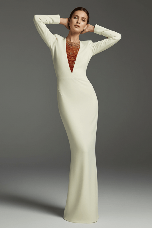 Aurora Radiance Gradient Chain Beaded by Luxe Lane | heath gown from Luxe Lane | SKU: | Barcode: | Options: White S | Woman wearing a long white dress with a gray background