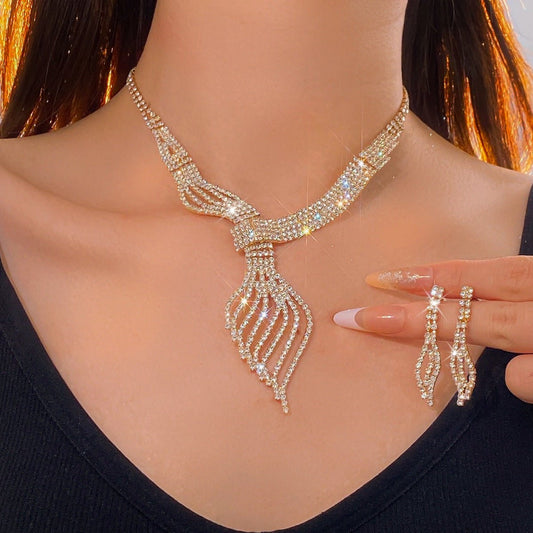 Diamond Clavicle Chain Necklace & Earrings Set by CJ | 0 from Luxe Lane | SKU: CJLX246770501AZ | Barcode: | Options: Gold | Woman wearing a sparkling necklace and earrings with a blurred background