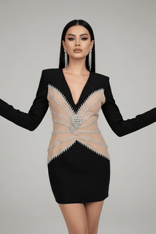 Ivory Halo Beaded Mini Club Dress by Luxe Lane | from Luxe Lane | SKU: | Barcode: | Options: Black S | Woman wearing a black dress with intricate beading on a gray background