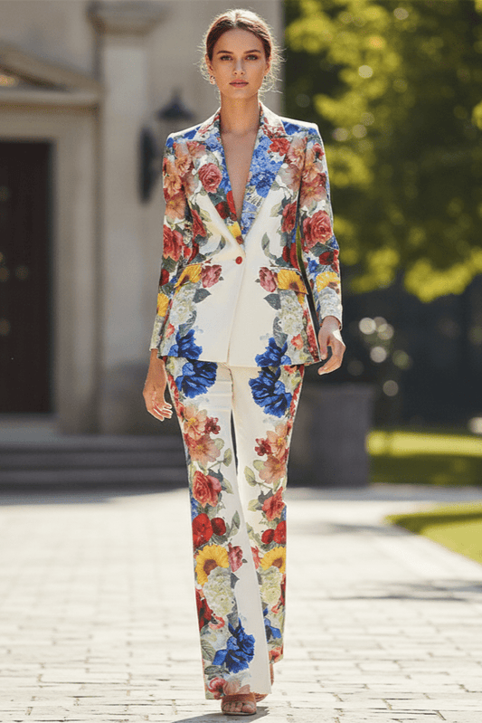 Juliette Bloom Floral Blazer & Wide - Leg Trouser Set by Shine | Pants Suits from Luxe Lane | SKU: | Barcode: | Options: White S | Woman in a colorful floral suit walking outdoors on a sunny day.