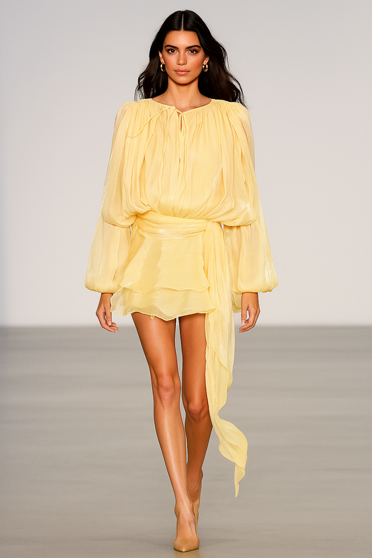 Woman wearing a yellow dress on a plain background