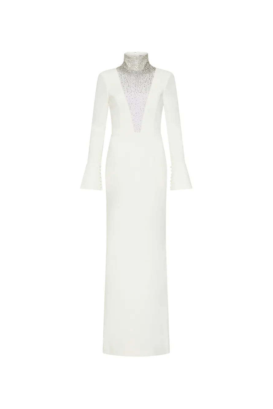 An off-white long-sleeve maxi dress with a high mock neck, featuring a textured, beaded silver V-neckline panel, shown on a plain white background.