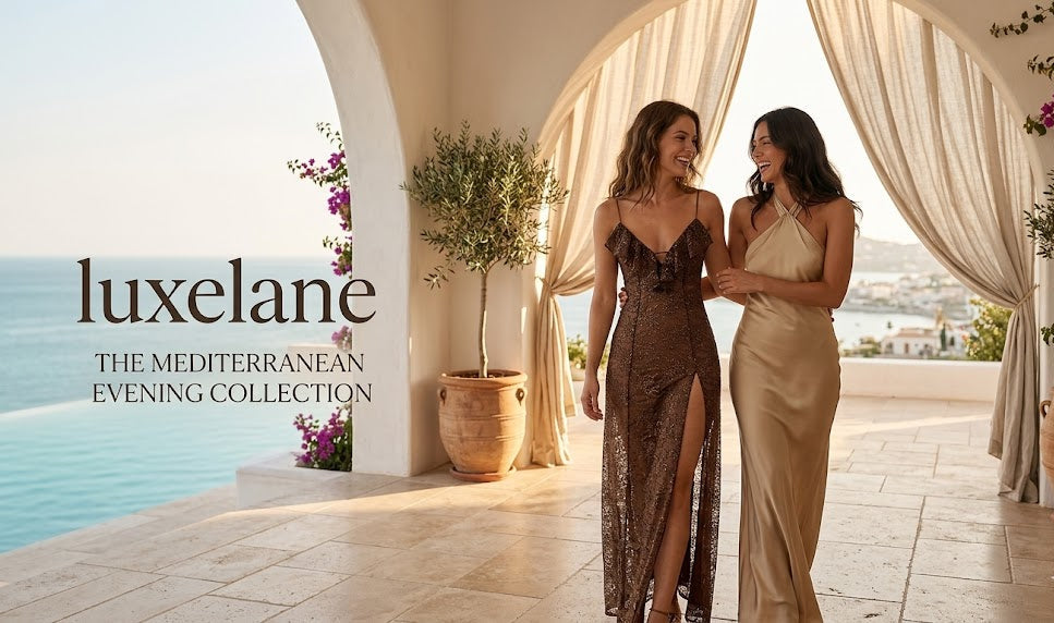 Two women in elegant evening gowns standing on a sunlit patio with 'luxelane' branding.