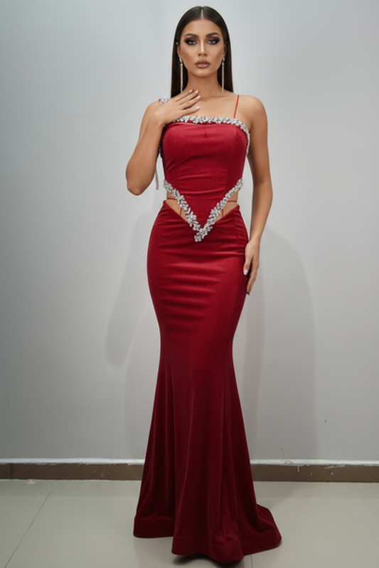 Woman wearing a red evening gown with a white background