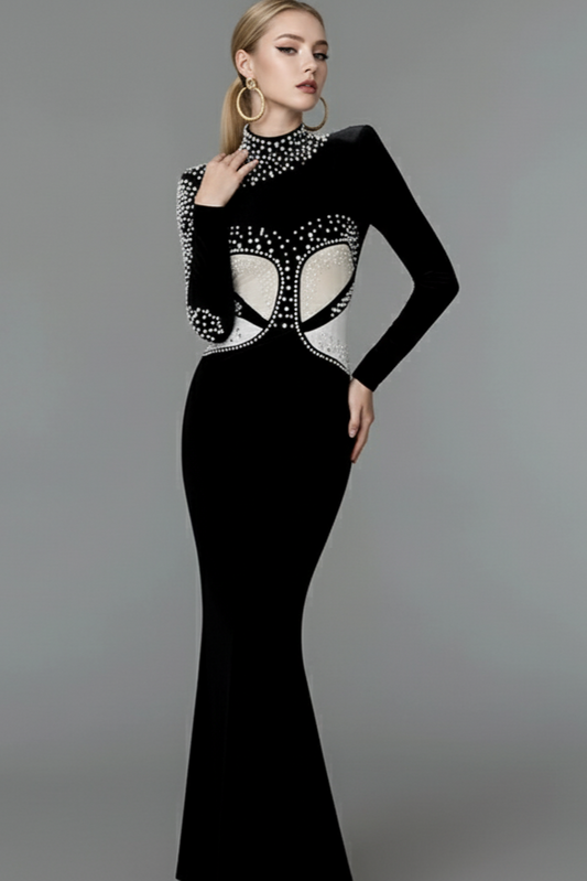 Black evening gown with white embellishments on a gray background
