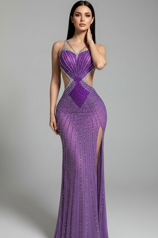 Woman wearing a purple evening gown with a high slit on a gray background