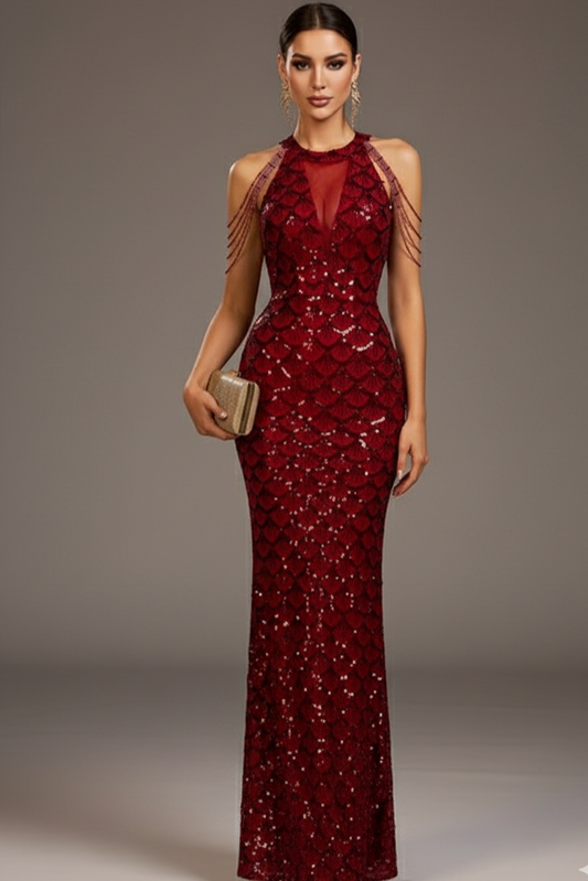 Woman wearing a red sequin evening gown against a gray background