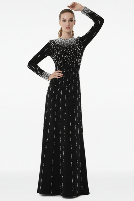 Black evening gown with silver embellishments on a white background