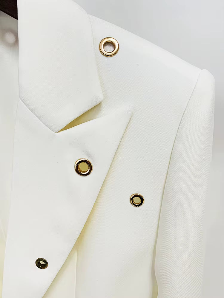 macro shot of Luxe Lane white blazer pocket with polished gold eyelets and neat seams with