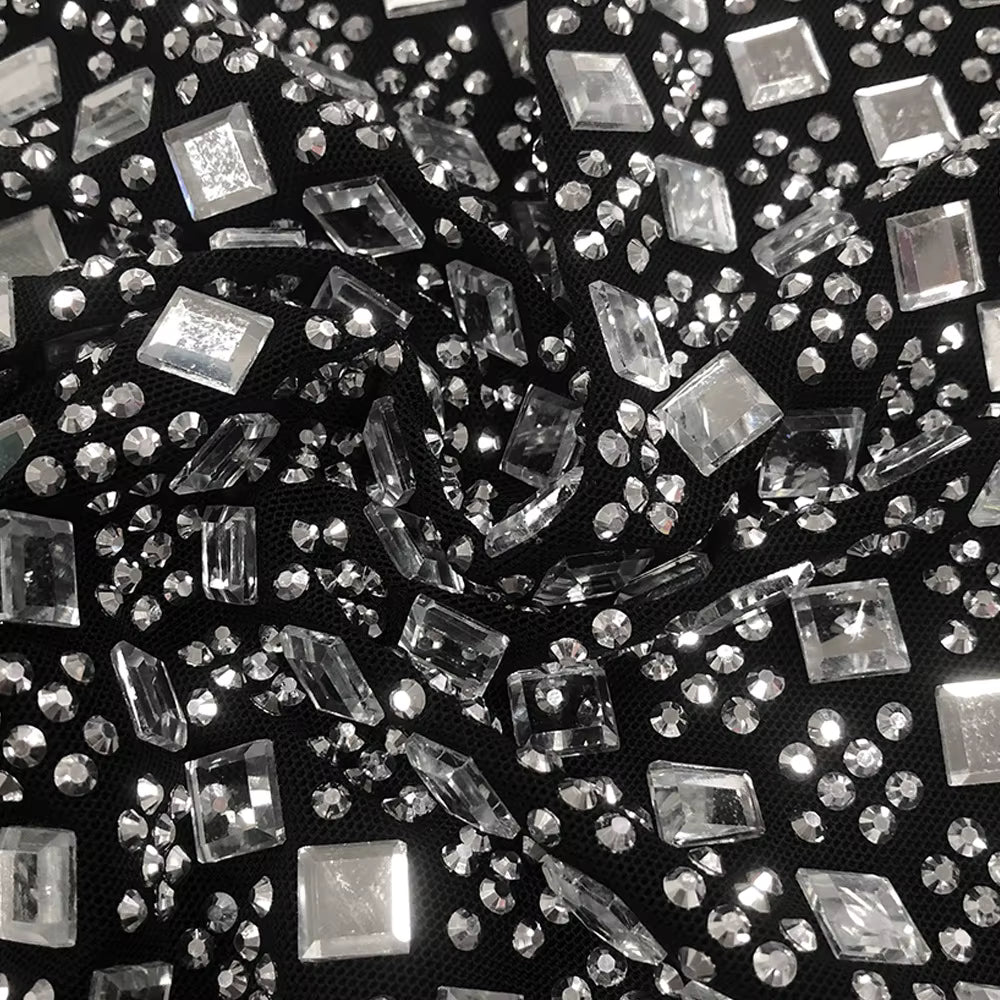 Close-up of clear rhinestones on a black background