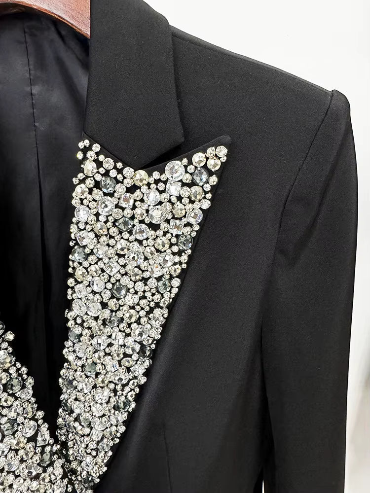 Black jacket with a decorative collar featuring crystals on a white background