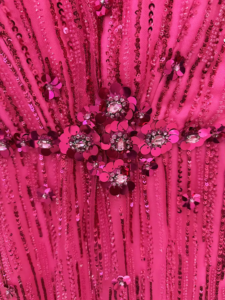 macro detail of Luxe Lane fuchsia bodice bead design with clustered crystals and sequins