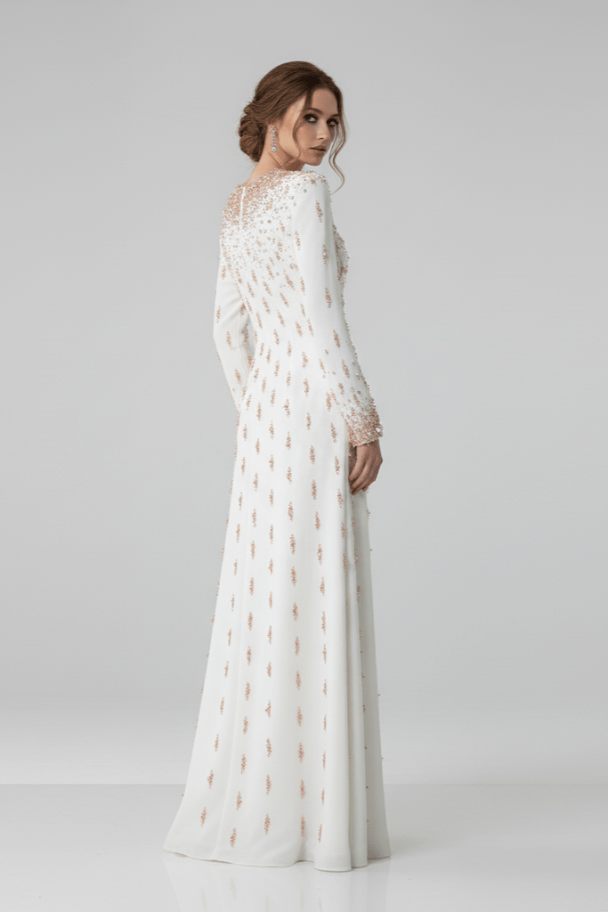 Amarise Beaded Sequin Evening Gown by Shine | heath gown from Luxe Lane | SKU: W11558-1 | Barcode:  | Options: White S | Woman wearing a long white lace dress on a gray background