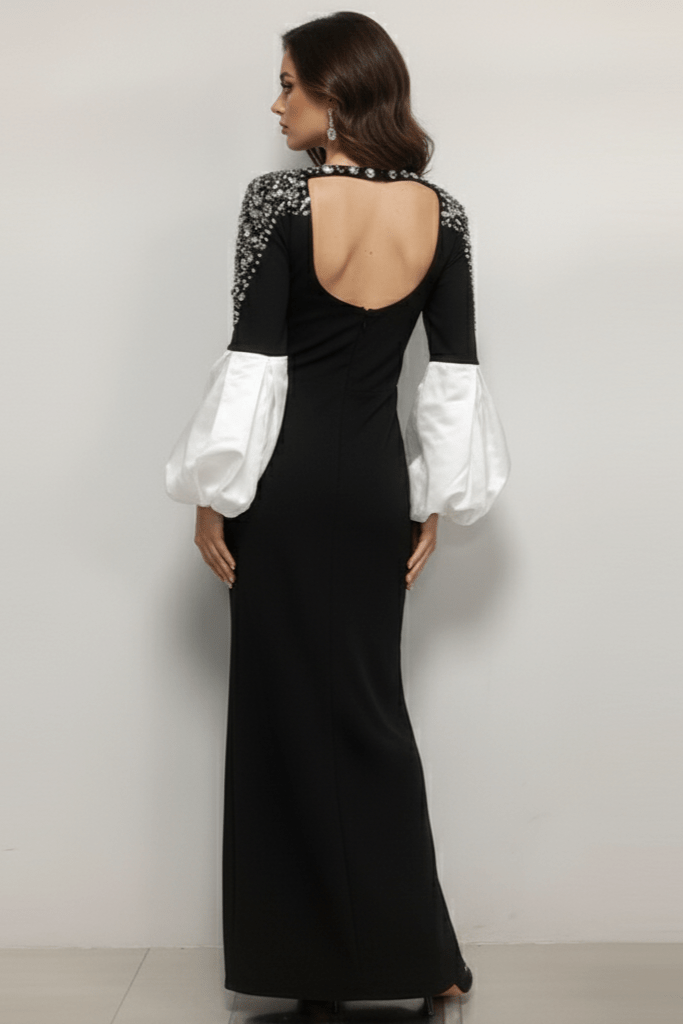 Amarise Rhinestone Puff - Sleeve Gown by Shine | heath gown from Luxe Lane | SKU: -1 | Barcode:  | Options: Black S | Woman wearing a black evening gown with white sleeves against a plain background