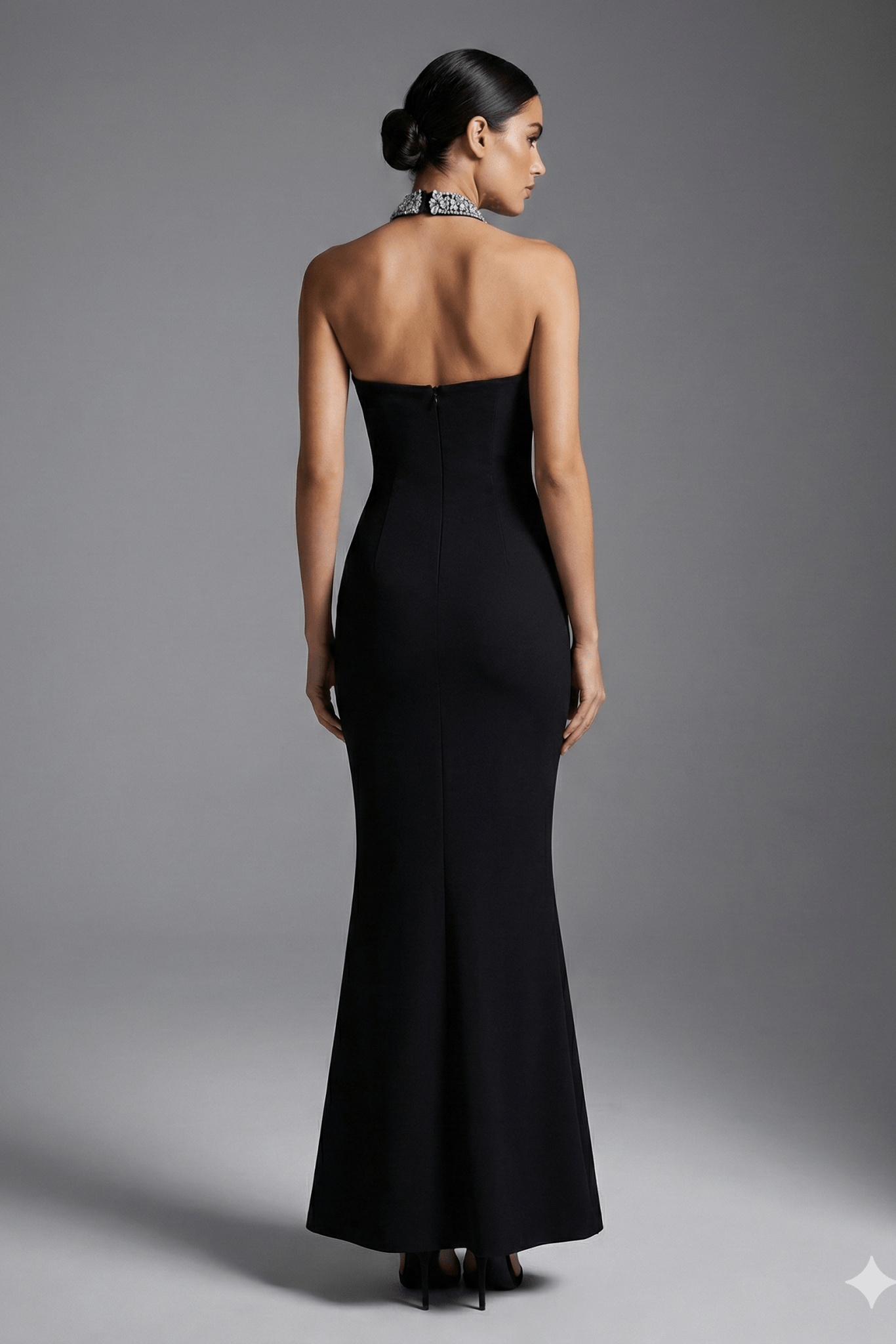 Aurelia Halter Rhinestone Bandage Mermaid Gown by Shine | Ball gown from Luxe Lane | SKU: -1 | Barcode:  | Options: Black S(6) | Woman wearing a black strapless gown with a high slit on a gray background