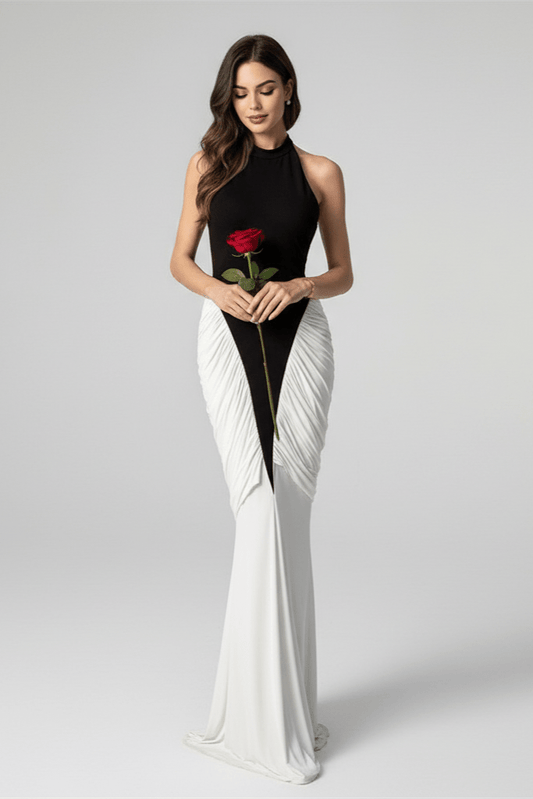 Averine Patchwork Halter Maxi Gown by Shine | mermaid gown from Luxe Lane | SKU: W11165-1 | Barcode:  | Options: White S | Woman in a black and white dress holding a red rose on a gray background
