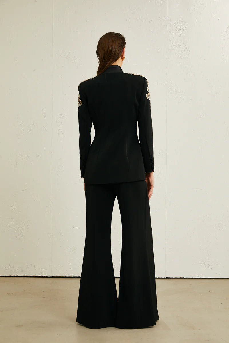Beaded Blazer & Slit Wide - Leg Pant Set by Luxe Lane | Pants Suits from Luxe Lane | SKU: 1688358-1 | Barcode:  | Options: Black S(6) | Person wearing a black suit with wide - leg pants against a white background