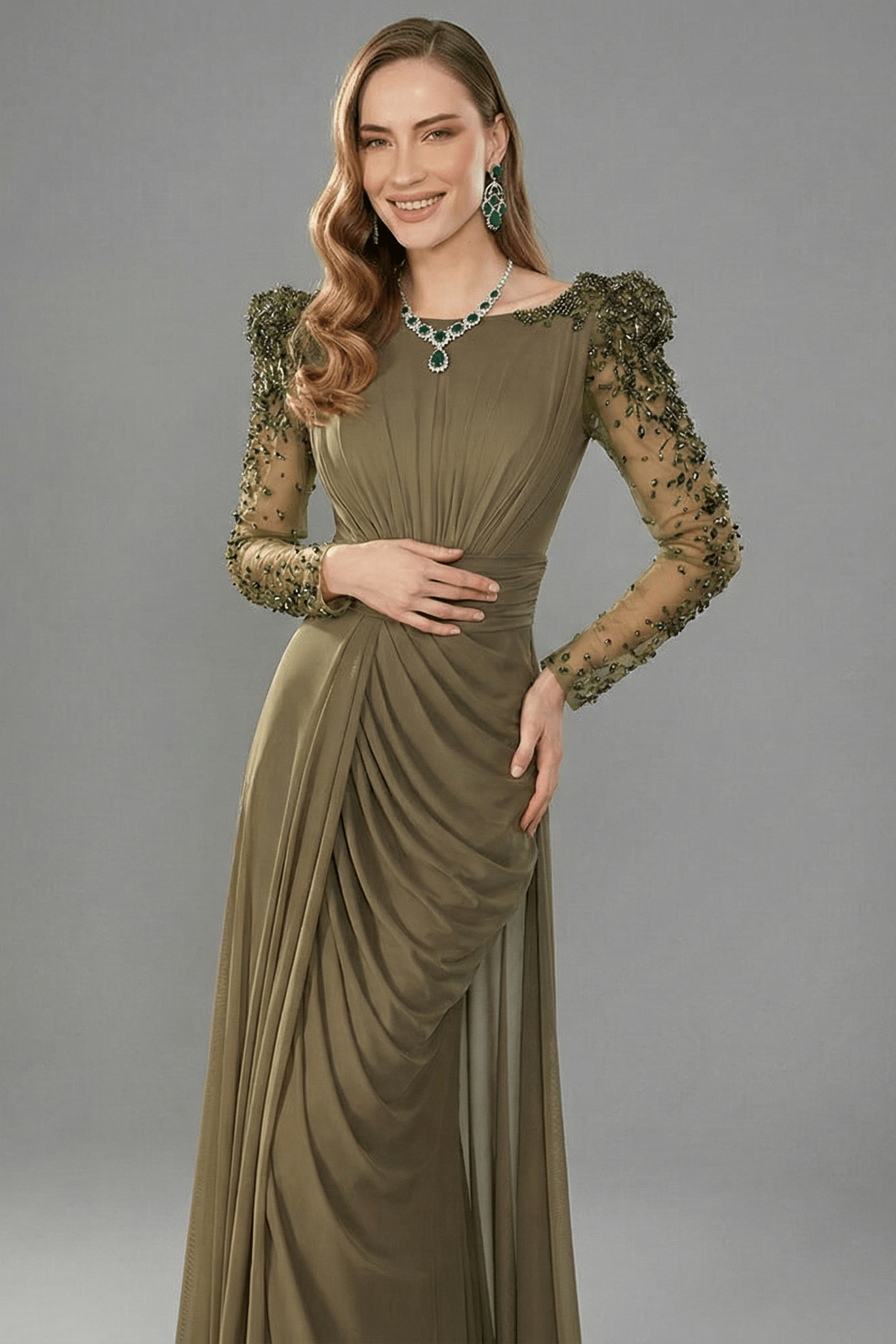 Beaded Long Sleeve High Slit Evening Gown by Guangdong | Party dresses from Luxe Lane | SKU: W11326-1 | Barcode:  | Options: green S(2) | Woman wearing a green evening gown with lace sleeves against a gray background