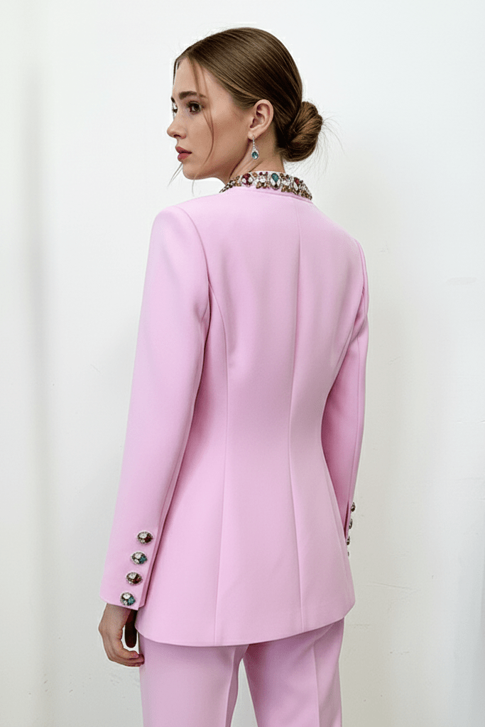 Beaded Rhinestone Blazer Two - Piece Set by Shine | 2 piece long set from Luxe Lane | SKU: -1 | Barcode:  | Options: Purple S(6) | Woman wearing a pink suit with decorative buttons on a plain background