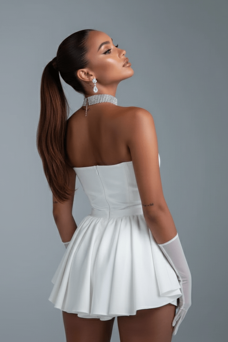 Bow Tube Mini Bodycon Dress by Luxe Lane | Club Dresses from Luxe Lane | SKU: DK120-1 | Barcode:  | Options: Black S(6) | Woman in a white dress with a gray background