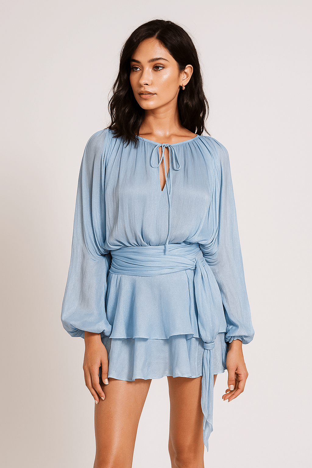 Celesta Pleated Ribbon Mini Dress by Luxe Lane | from Luxe Lane | SKU: -33 | Barcode:  | Options: green S | Woman wearing a light blue dress with long sleeves on a plain background