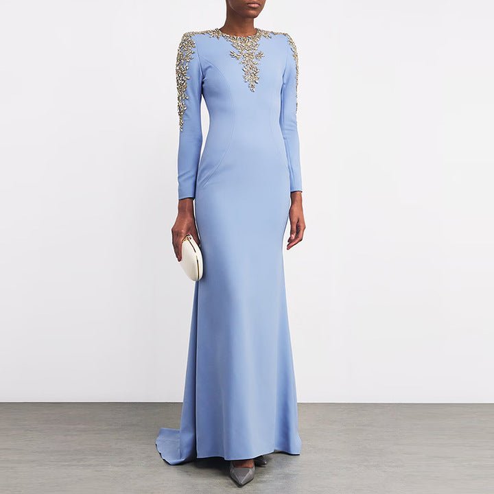 Celeste Regalia Crystal Gown by Luxe Lane | Evening Dresses from Luxe Lane | SKU: W11318-1 | Barcode:  | Options: Sky Blue S | Elegant Light Blue Maxi Occassion Dress Luxurious Beaded Gold Rhinestones Neckline Long Sleeve Formal Party Gown Evening Dresses