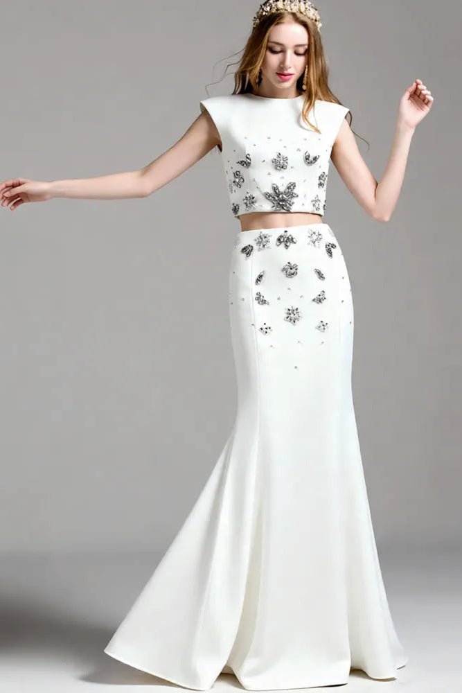 Crystal Floral Two - Piece Maxi Skirt Set by Luxe Lane | one set from Luxe Lane | SKU: -1 | Barcode:  | Options: White S(2) | Woman wearing a white two - piece outfit with floral embellishments on a gray background