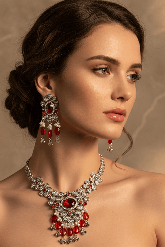 Crystal Necklace & Earrings Set – Luxury Vintage Jewelry by CJ | 0 from Luxe Lane | SKU: CJLX253583301AZ | Barcode:  | Options: Crystals | Woman wearing a luxurious red and silver necklace and earrings against a warm background