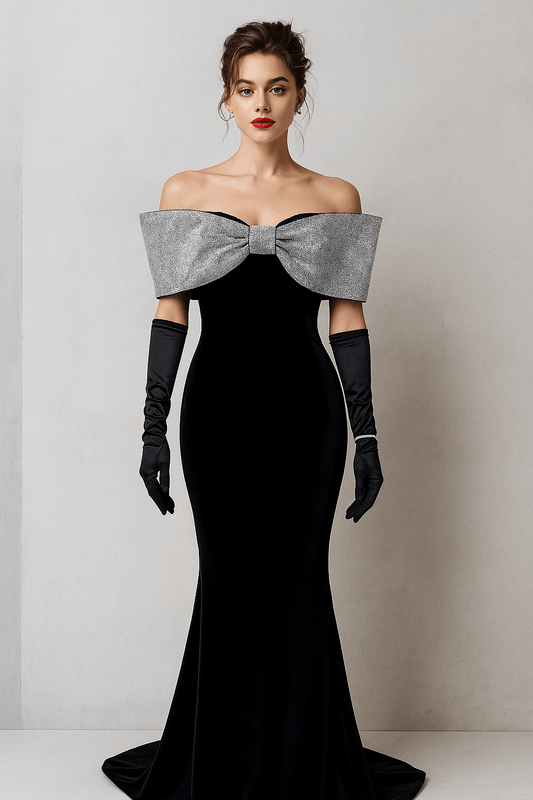 Customized Premium Mermaid Gown by Luxe Lane | from Luxe Lane | SKU:  | Barcode:  | Options: S | Woman wearing a black evening gown with a large bow and black gloves against a plain background