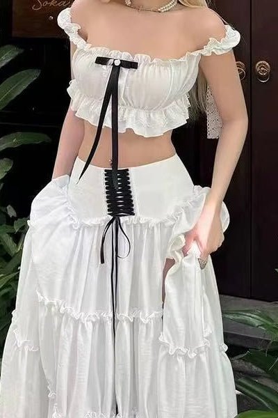 Elan Blanche Ruffle Set by Shine | one set from Luxe Lane | SKU:  | Barcode:  | Options: White XS | Elegant Formal Event Vacation Wear 2 Piece Set Chic White Ruffled Bandeau Top and Layered Long Skirt Set With Black Bow Straps