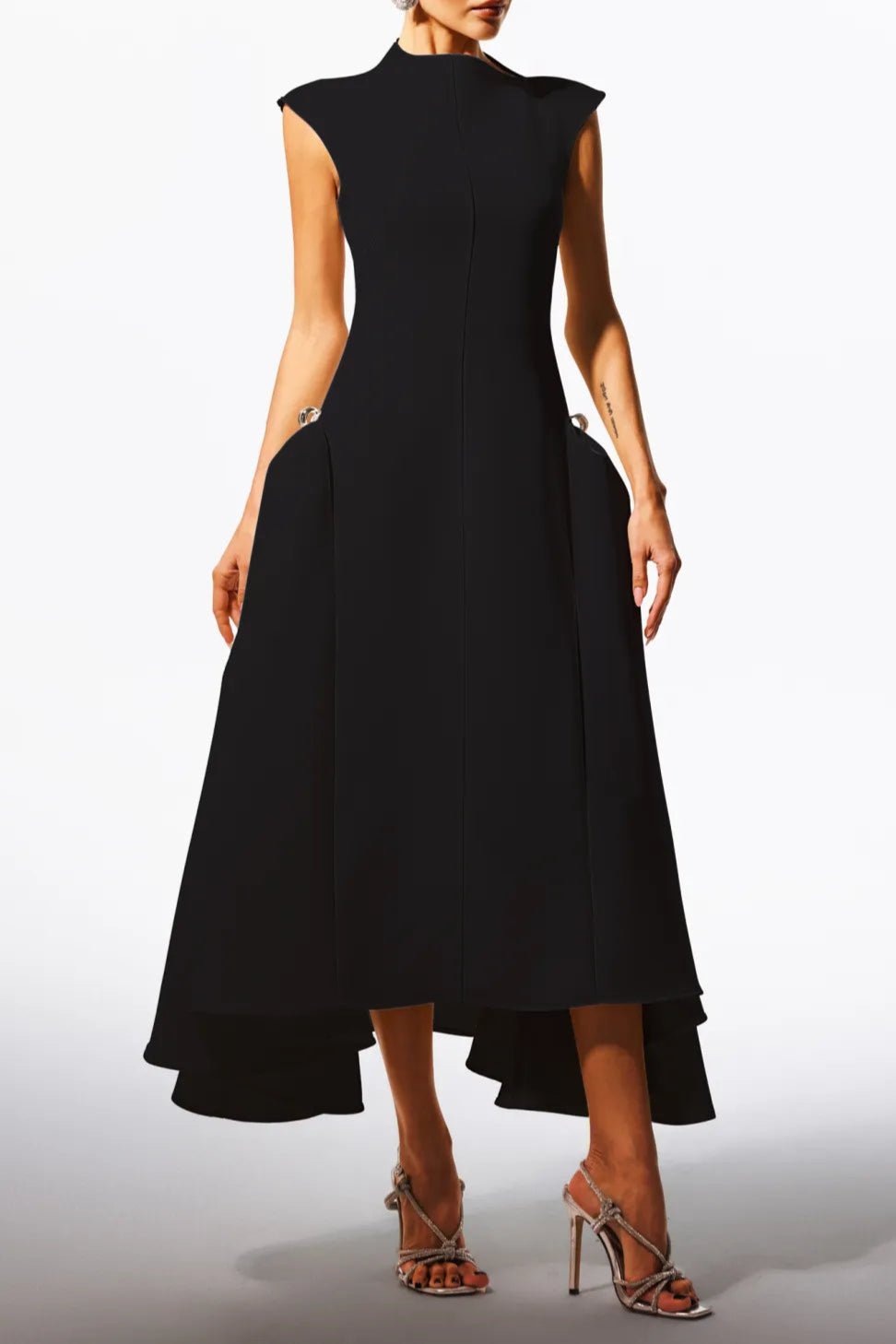Elara Slanted Collar Ruffle Midi Dress by Luxe Lane | from Luxe Lane | SKU:  | Barcode:  | Options: Black S | Black sleeveless dress with a high - low hem on a white background