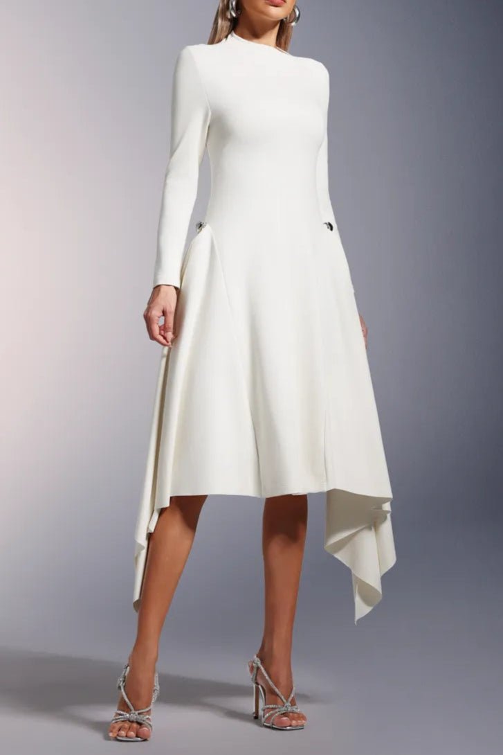 Elara Slanted Collar Ruffle Midi Dress by Luxe Lane | from Luxe Lane | SKU:  | Barcode:  | Options: Brown S | Woman wearing a white dress with long sleeves and an asymmetrical hem on a gray background