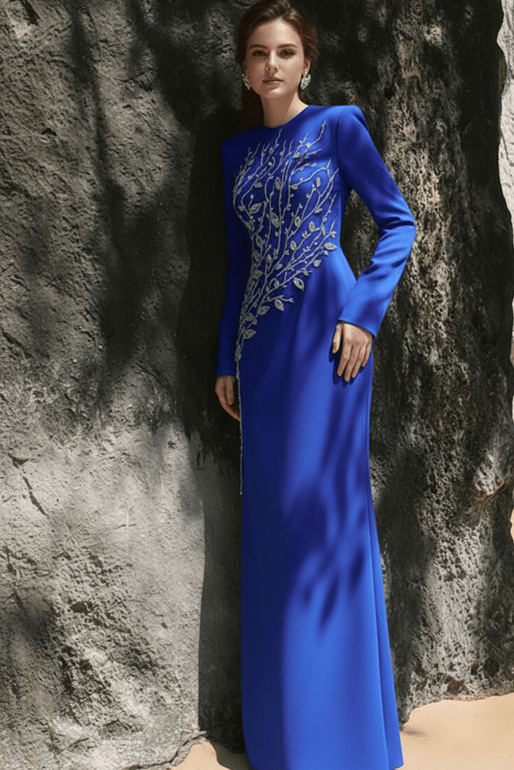 Elaria Beaded Rhinestone Floral Gown by Shine | from Luxe Lane | SKU: W11288-13 | Barcode:  | Options: Blue S | Woman in a blue evening gown standing against a rocky background