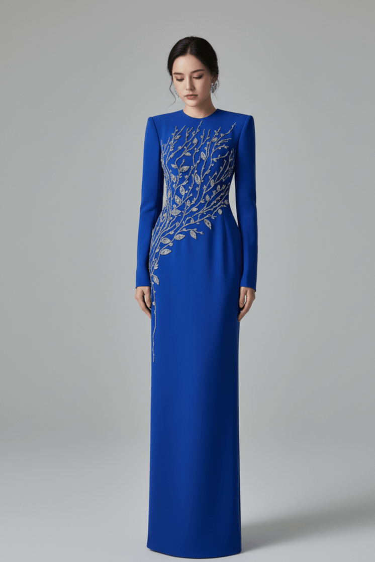 Elaria Beaded Rhinestone Floral Gown by Shine | from Luxe Lane | SKU: W11288-13 | Barcode:  | Options: Blue S | Woman wearing a blue evening gown with intricate silver embroidery on a gray background