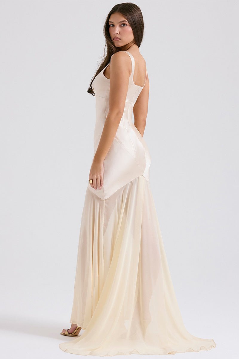 Elegant Satin Chiffon Mermaid Dress by Luxe Lane | from Luxe Lane | SKU:  | Barcode:  | Options: Blue XS | Woman wearing a flowing white dress on a plain background