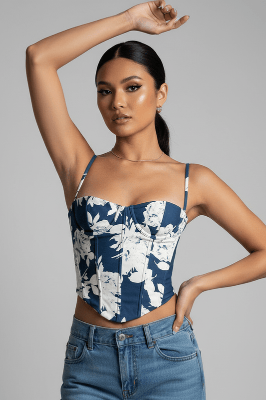 Floral Print Corset Top by Luxe Lane | from Luxe Lane | SKU:  | Barcode:  | Options: XS | Woman wearing a blue floral top and jeans on a gray background