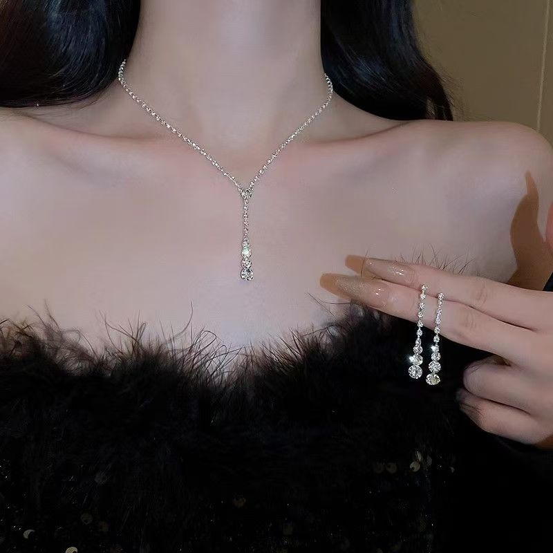 Fringe Rhinestone Necklace & Earrings Set by CJ | 0 from Luxe Lane | SKU: CJLX246751509IR | Barcode:  | Options: Silver Set H | Fringe Rhinestone Necklace & Earrings Set