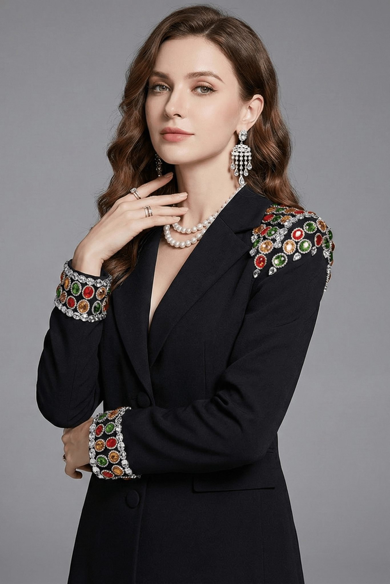 Gemstone Shoulder Tailored Long Blazer Jacket by Luxe Lane | Outerwear from Luxe Lane | SKU: -1 | Barcode:  | Options: Black S(2) | Woman wearing a black blazer with colorful embellishments on a gray background