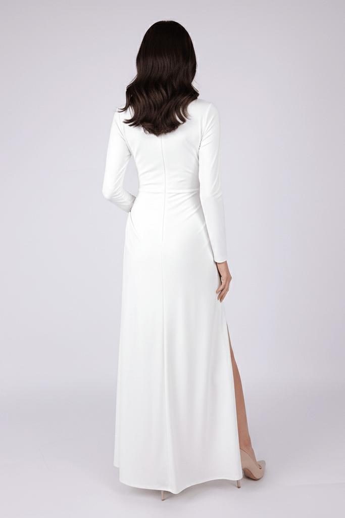 High Neck Long Sleeve Split Maxi Dress by Luxe Lane | from Luxe Lane | SKU: -1 | Barcode:  | Options: White XS(4) | Woman wearing a white long - sleeve gown with a high slit on a light gray background