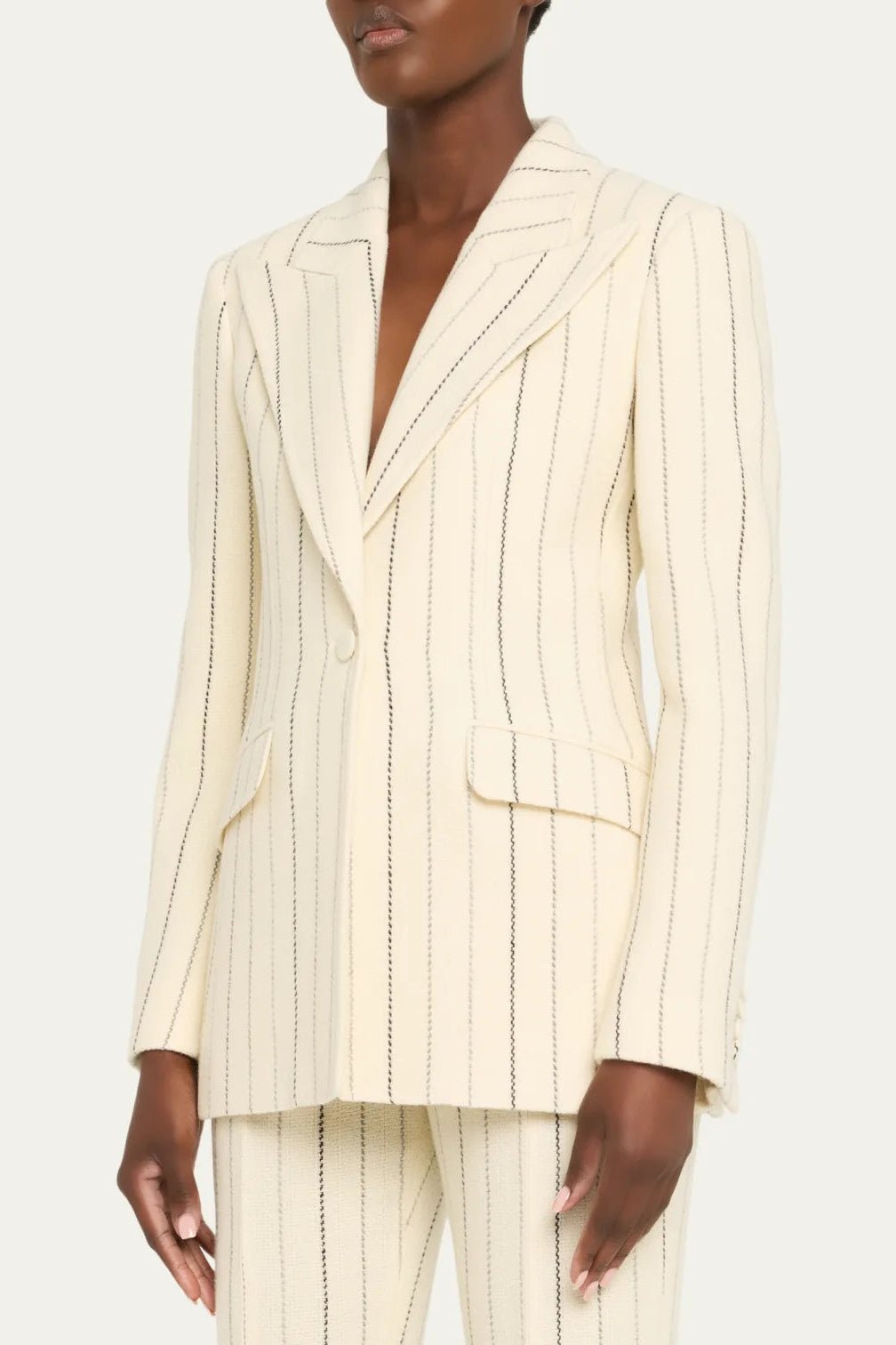 Ivory Pinstripe Tailored Blazer & Flared Pants Suit by Shine | Blazer from Luxe Lane | SKU:  | Barcode:  | Options: S(2) | Person wearing a cream pinstripe suit on a white background