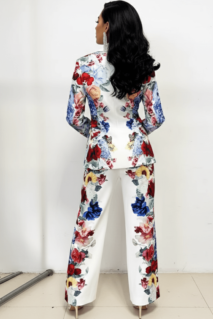 Juliette Bloom Floral Blazer & Wide - Leg Trouser Set by Shine | Pants Suits from Luxe Lane | SKU:  | Barcode:  | Options: White S | Woman wearing a colorful floral suit against a white background