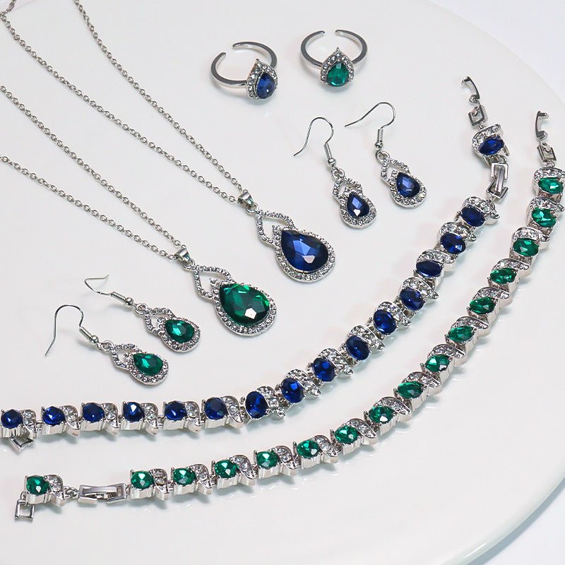 Luxury Zircon Necklace, Earrings & Ring Jewelry Set by CJ | 0 from Luxe Lane | SKU: CJLX246915201AZ | Barcode:  | Options: Green | Jewelry set with necklaces, earrings, and rings featuring blue and green gemstones on a white background.