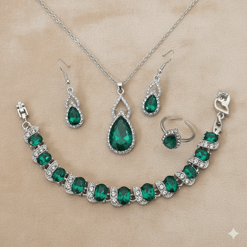 Luxury Zircon Necklace, Earrings & Ring Jewelry Set by CJ | 0 from Luxe Lane | SKU: CJLX246915201AZ | Barcode:  | Options: Green | Jewelry set with emerald green stones on a beige background