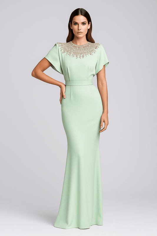 Mint Green Beaded Cape by Luxe Lane | heath gown from Luxe Lane | SKU:  | Barcode:  | Options: Mint Green S | Woman wearing a light green evening gown with cap sleeves and beaded neckline on a gray background