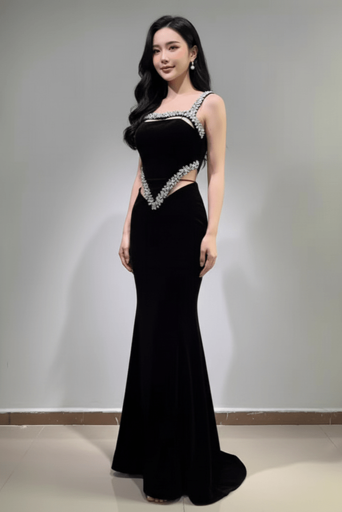Novara Crystal Velvet Mermaid Gown by Luxe Lane | Party dresses from Luxe Lane | SKU:  | Barcode:  | Options: Black S | Woman wearing a black evening gown with silver embellishments against a plain background