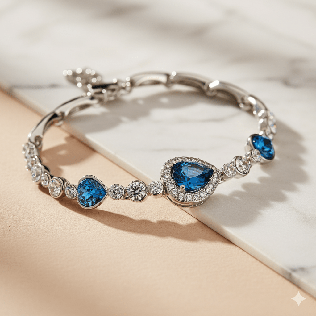 Ocean Heart Necklace & Earring Set by CJ | 0 from Luxe Lane | SKU: CJLX143524601AZ | Barcode:  | Options: Bracelet & Earrings Set | Silver bracelet with blue gemstones on a light background