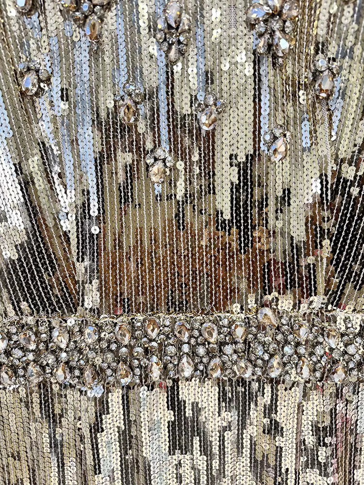 Close-up of a decorative fabric with sequins and beads