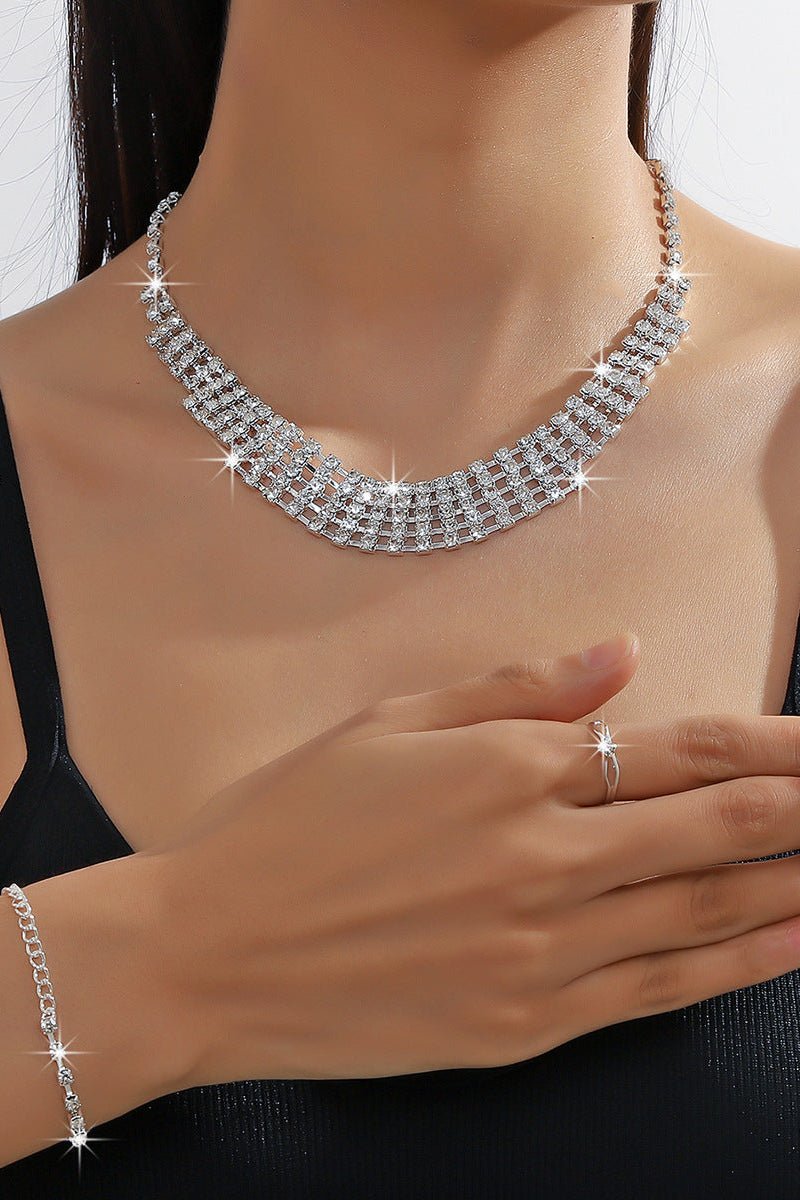 Rhinestone Chain Jewelry Set – Necklace, Bracelet & Earrings by CJ | 0 from Luxe Lane | SKU: CJLX232427001AZ | Barcode:  | Options: | Silver necklace, ring, and bracelet on a person against a neutral background