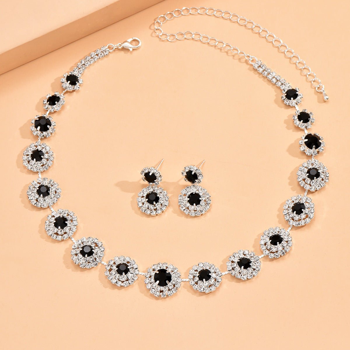 Round Rhinestone Quartz Necklace & Earrings Set by CJ | 0 from Luxe Lane | SKU: CJLX246901902BY | Barcode:  | Options: Black | Round Rhinestone Quartz Necklace & Earrings Set